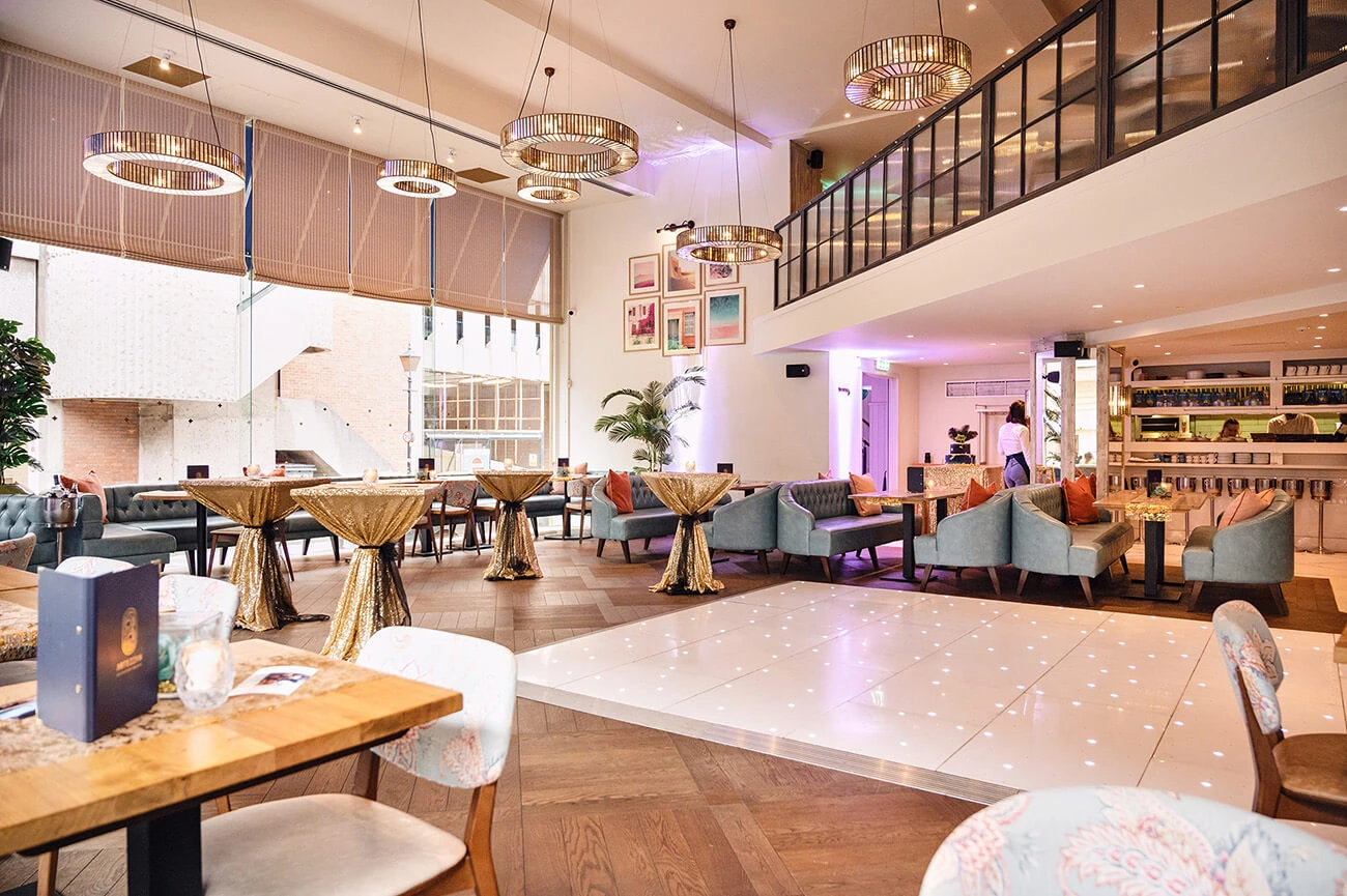 Artezzan restaurant in Chester prepared for a stylish private event with dressed tables and atmospheric lighting